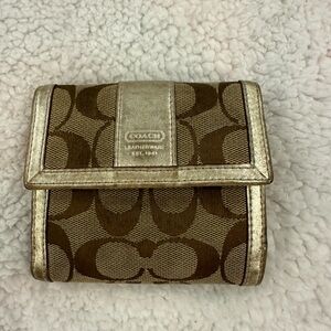 Gently used vintage coach wallet in classic colours